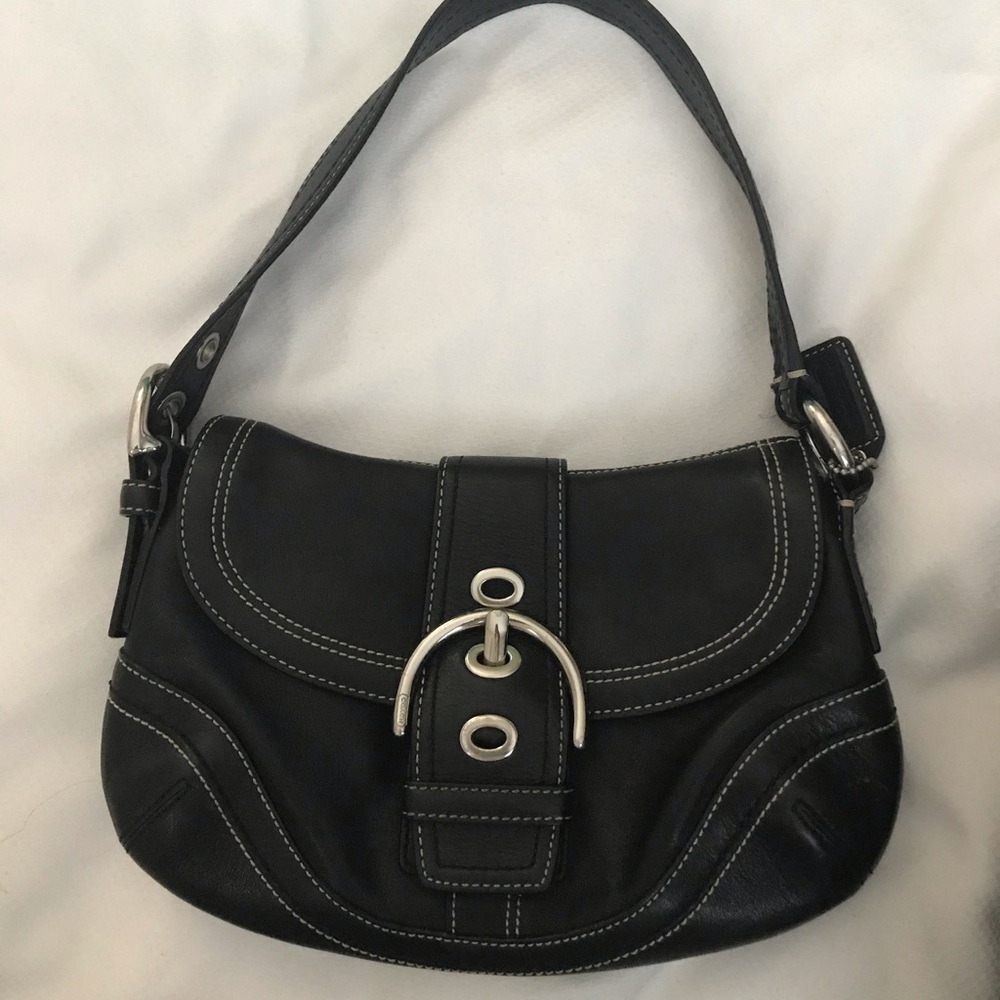 Coach black leather shoulder bag with belt and grommet details 🌸